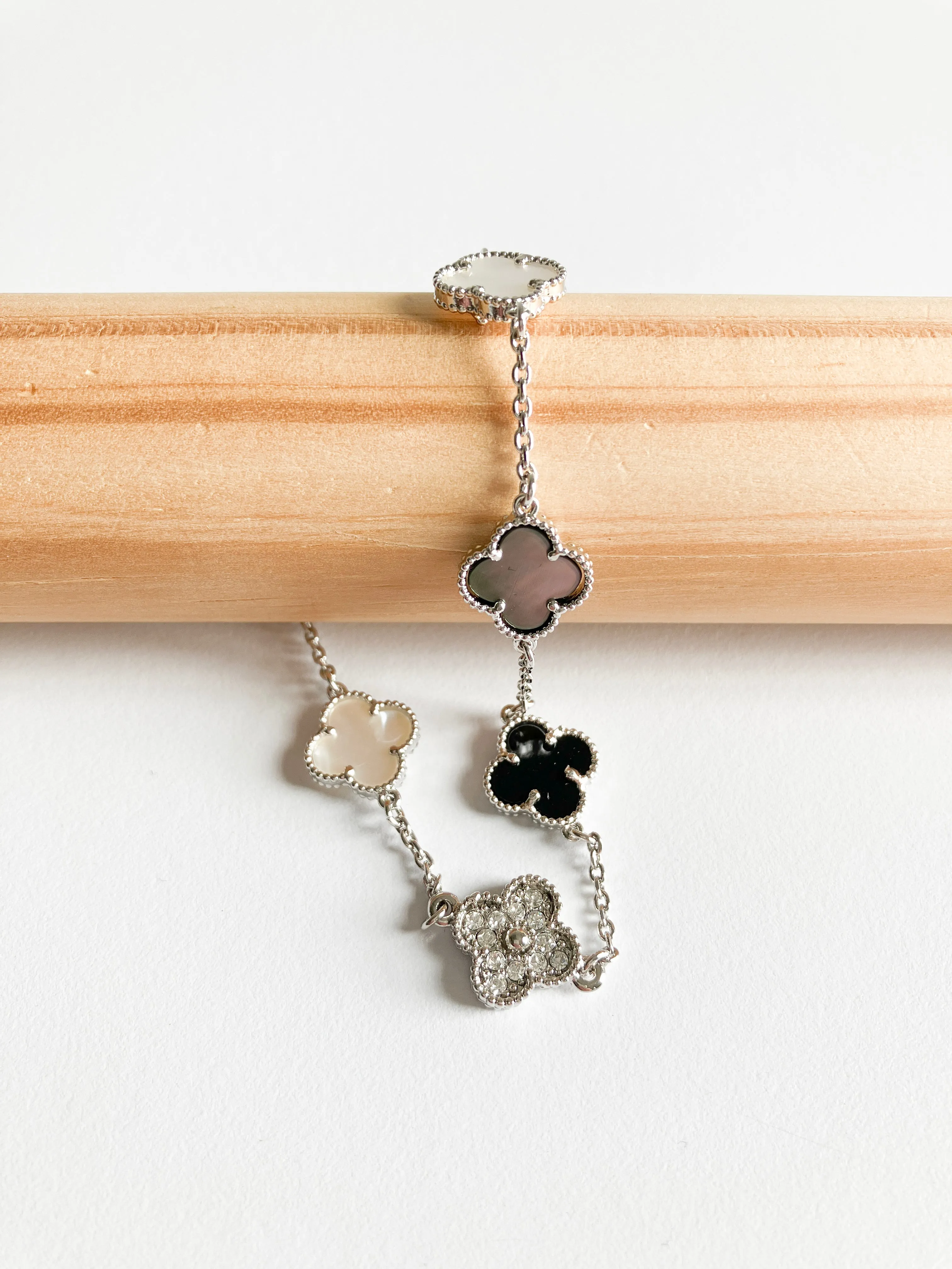 Cubic Zirconia, Mixed Mother of Pearl, and Onyx Small Quatrefoil Bracelet in Gold