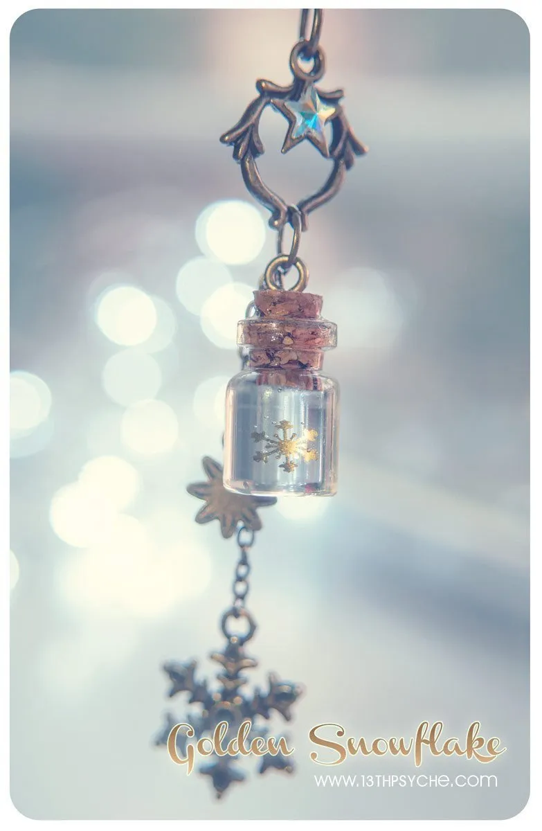 Golden snowflake glass bottle pendant necklace