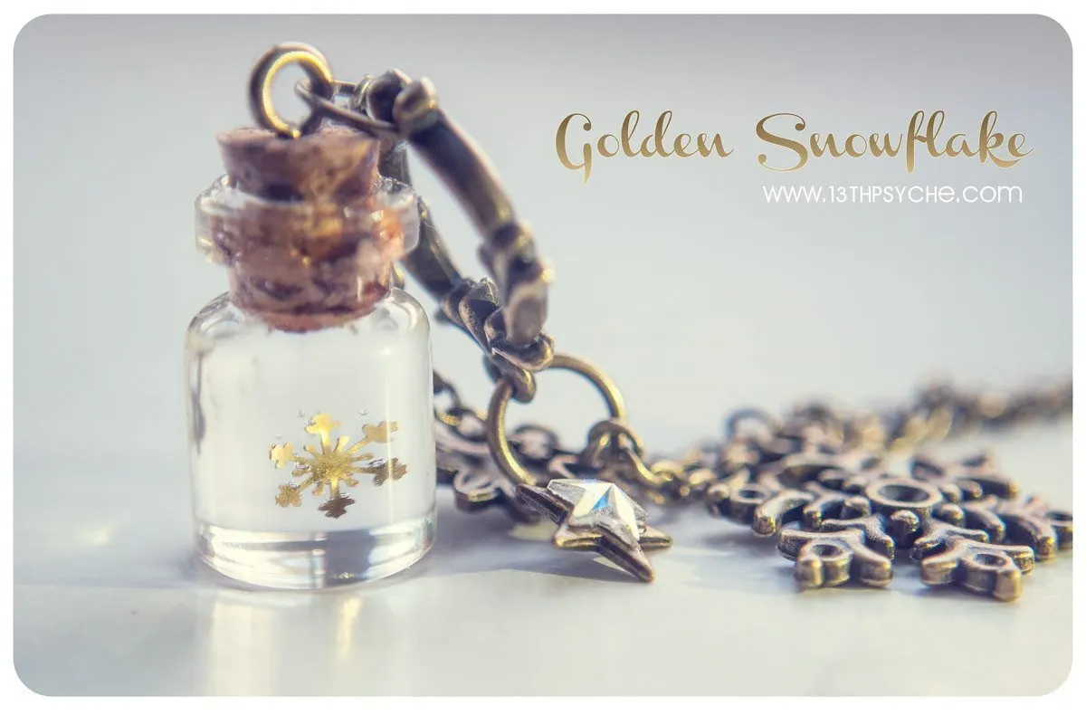 Golden snowflake glass bottle pendant necklace